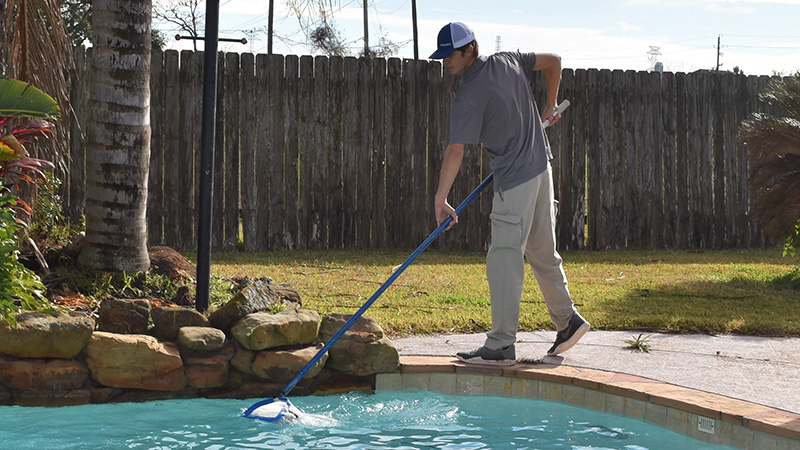 The Pool Boys Tech netting the pool